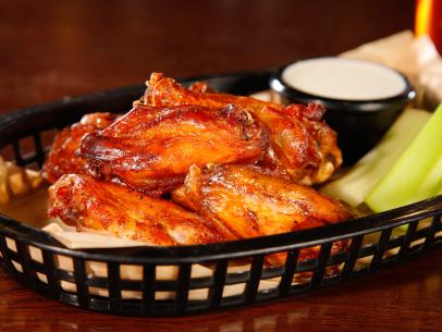 WS of a basket of Smoked Wings with celery and ranch from the Smokehouse in Minneapolis, MN as seen on Food Network's Diners, Drive-Ins and Dives in episode DV2311.