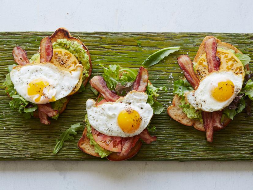 FNK AVOCADO BLT TOAST Food Network Kitchen Food Network Avocados, Scallions, Lemon Juice, Red Pepper Flakes, Bacon, Unsalted Butter, Sourdough Bread, Mixed Greens, Tomatoes, Eggs