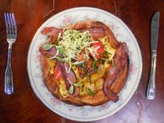 <p>This garage-turned-restaurant offers innovative brunch dishes like the sweet-and-savory mash-up known as the BLT Dutch Baby Pancake. A puffy, pastrylike base made from pancake batter is topped with aioli and bacon jam, then loaded with peppery strips of bacon, marinated tomatoes and fresh greens.</p>