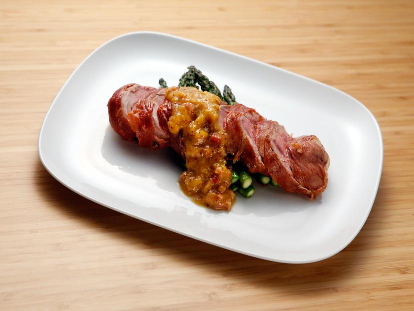 Host Anne Burrell's Prosciutto wrapped Pork Tenderloin with Peach Chutney is displayed on the set of on Food Network's Worst Cooks in America, Season 8.