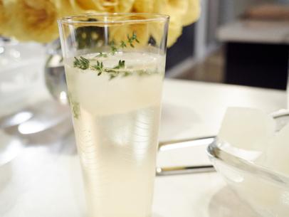 Detail of Host Giada de Laurentiis' drink, Lemon and Thyme Prosecco Cocktail, as seen on Food Network’s Giada Entertains, Season 1.