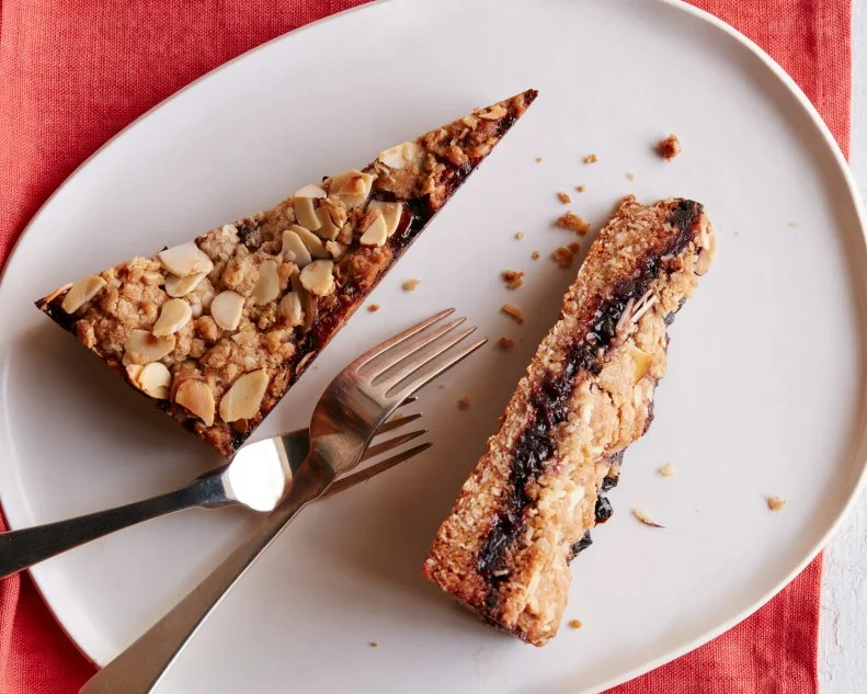 FNK CHERRY CRUMBLE BARS FOR TWO Food Network Kitchen Food Network Cherry Preserves, Dried Cherries, Unsalted Butter, Allpurpose Flour, Quick Cooking Oats, Light Brown Sugar, Confectioners’ Sugar, Baking Soda, Skinon Sliced Almonds