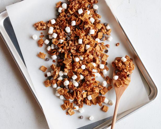 FNK S’MORES GRANOLA Food Network Kitchen Food Network Unsalted Butter, Light Brown Sugar, Honey, Vanilla Extract, Rolled Oats, Graham Flavored Cereal, Mini Marshmallows, Semisweet Chocolate Chips