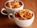 FNK CARAMEL BREAD PUDDING FOR TWO Food Network Kitchen Food Network Butter, Croissants, Egg, Sugar, HalfandHalf, Vanilla Extract, Soft Caramels