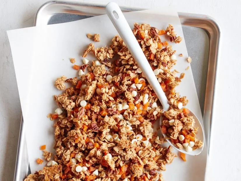 FNK PEACH COBBLER GRANOLA Food Network Kitchen Food Network Unsalted Butter, Light Brown Sugar, Peach Preserves, Vanilla Extract, Rolled Oats, Pecans, Dried Peaches, White Chocolate Chips