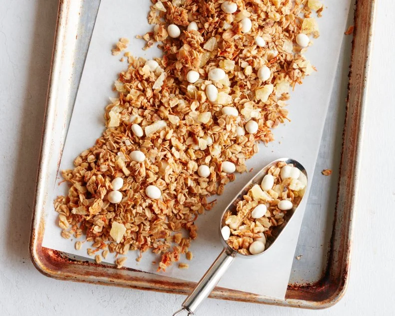 FNK CARROT CAKE GRANOLA Food Network Kitchen Food Network Unsalted Butter, Light Brown Sugar, Maple Syrup, Vanilla Extract, Cinnamon, Rolled Oats, Carrots, Walnuts, Yogurt Covered Raisins, Dried Pineapple