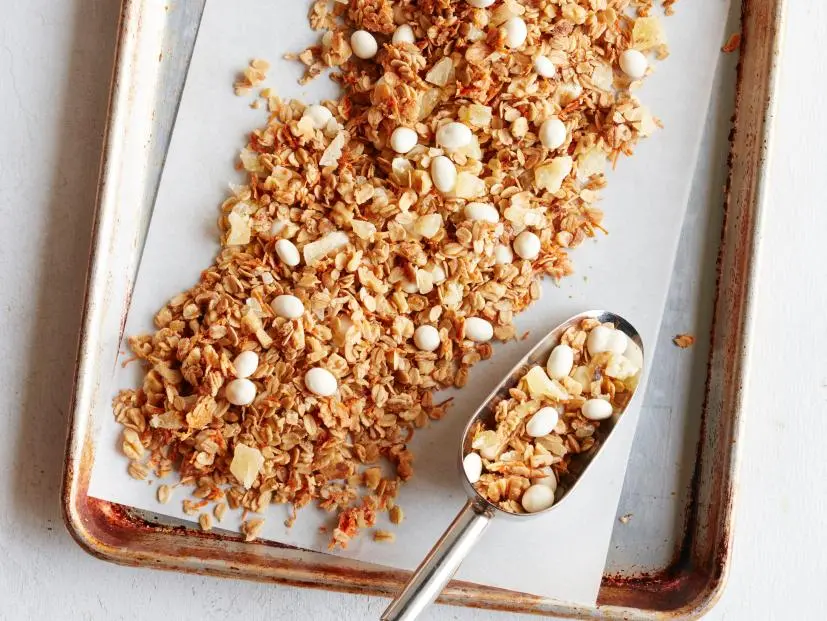 FNK CARROT CAKE GRANOLA Food Network Kitchen Food Network Unsalted Butter, Light Brown Sugar, Maple Syrup, Vanilla Extract, Cinnamon, Rolled Oats, Carrots, Walnuts, Yogurt Covered Raisins, Dried Pineapple