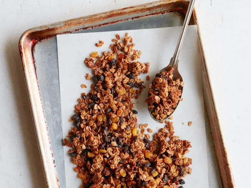 FNK OATMEAL RAISIN COOKIE GRANOLA Food Network Kitchen Food Network Unsalted Butter, Light Brown Sugar, Maple Syrup, Vanilla Extract, Cinnamon, Nutmeg, Rolled Oats, Raisins, Golden Raisins