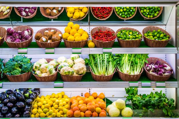 Fruits and vegetables on a supermarket shelf.