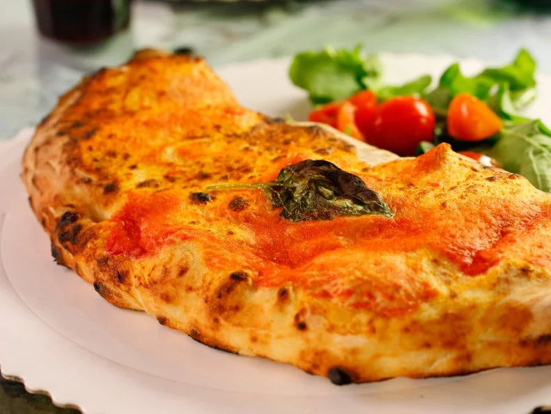 WS of the Napolitano calzone from Il Gusta Pizza in Florence, Italy as seen on Diners, Drive-Ins and Dives episode DV2203.