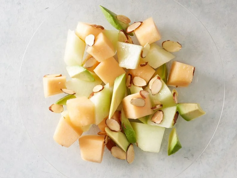 Food Network Kitchenâ  s Cantaloupe, Honeydew, Avocado, and Toasted Almonds Salad as seen on Food Network.