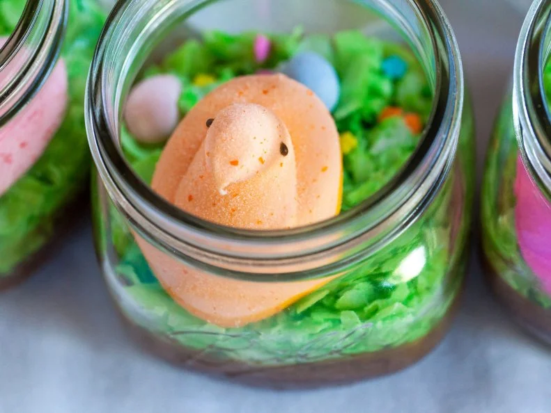 Bake brownies in mason jars then top with colored coconut, chocolate eggs, sprinkles and Peeps! . Food Photography, Ideas and Recipes By Jackie Alpers for Food Network.