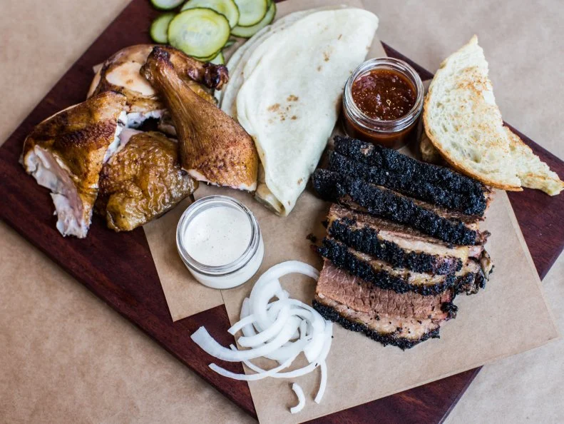 With its modern, minimalist aesthetic and deliciously smoky aroma, Butchertown Hall was met with rave reviews when it opened in Germantown in February 2015. Combining the “Texo-German” mash-up cuisine found in Texas Hill Country (which also includes Mexican and barbecue influences) and a solid, Belgian-heavy beer list, Butchertown is the ideal casual place to gather with friends. Menu stars include the beef brisket plate, served with pickles, onions and Texas toast or tortillas, as well as any of the housemade sausages, in German, Czech and Mexican styles. Beer curator Dan King collaborates closely with local brewers to put a steady rotation of custom brews at the top of his draft list, too. 