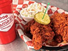 <p>Hattie B&rsquo;s serves the fiery local favorite known as hot chicken in five heat levels, from Southern (no spice) to Shut the Cluck Up (not for the faint of heart). Round out your meal with draft beer, a comforting Southern side like pimento mac and cheese, and blackberry cobbler for a sweet finish.</p>