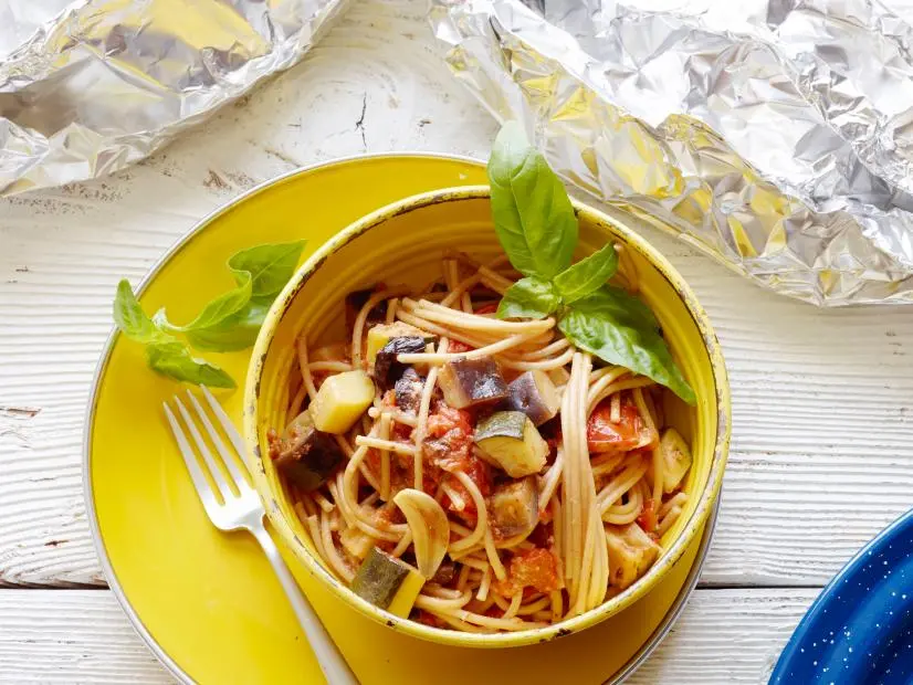 FNK HEALTHY GRILLED SUMMER VEGETABLE SPAGHETTI FOIL PACK, Food Network
Kitchen, Tomatoes, Japanese Eggplant, Zucchini, Olives, Garlic, Sundried Tomato Pesto,
Olive Oil, Crushed Red Pepper, Whole Wheat Spaghetti, Dry White Wine, Parmesan Cheese,
Basil