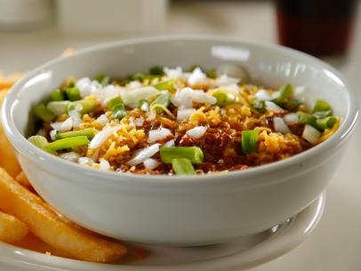 WS of a bowl of Texas Chili with a side of french fries from the 24th Street CafÃ© in Bakersfield, CA as seen on Food Network's, Diners, Drive-Ins and Dives episode 2208.