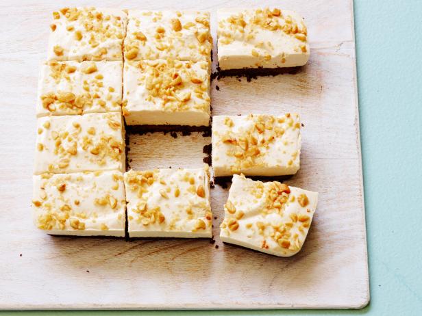 FNK HEALTHY NOBAKEPEANUT BUTTER CHEESECAKE BARS, Food Network Kitchen,Semisweet Chocolate, Unsalted Butter, Graham Crackers, Unflavored Powdered Gelatin,LowFatCream Cheese, Buttermilk, Peanut Butter, Light Brown Sugar, Vanilla Extract,HoneyRoastedPeanuts