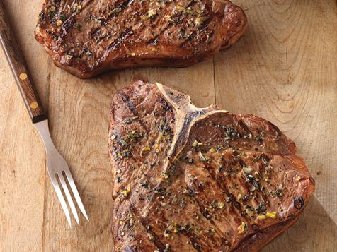 Greek-Seasoned T-Bone Steaks with Cucumber and Tomato Salad