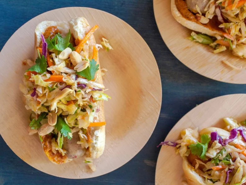 The Thai Hot Dog by Jackie Alpers for FoodNetwork.com. Spicy Chicken Sauage, Peanut sauce, Thai slaw, peanuts and Cilantro.