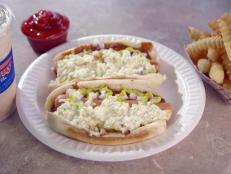For a deliciously messy spin on a classic American staple, dig into the Onion Coleslaw Chili Dog at Midway. This juicy dog is topped with a tasty combo of homemade coleslaw and a flavorful chili featuring a secret blend of spices. Go all out by adding fries and a milk shake to your meal.