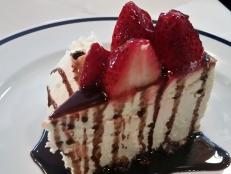 This popular Manhattan spot has stepped up the diner dessert game with its Strawberry Blonde Cheesecake. This tantalizing creation is coated with crushed hazelnuts (which add to its creamy, dense texture), topped with ruby-red strawberries, then served with a side of ice cream and chocolate sauce.