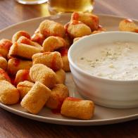 BAKED BUFFALO CAULIFLOWER TOTS, Food Network Kitchen, Food Network, PlainYogurt, Milk, Mayonnaise, Lemon Juice, Worcestershire Sauce, Cayenne Pepper, BlueCheese, Olive Oil, Onion, Cauliflower, Almond Meal, Eggs, Hot Sauce, Crispy Rice Cereal