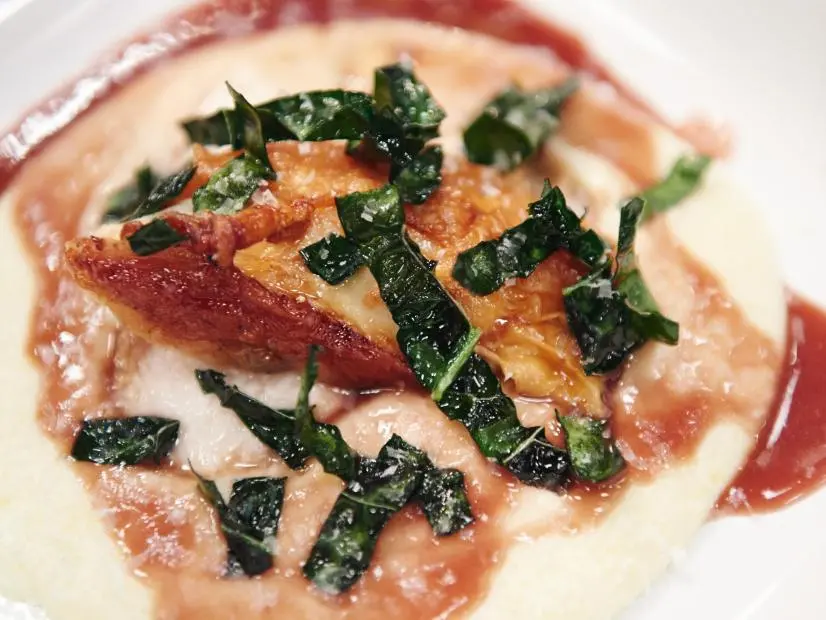 Finalist Dom Tesoriero's dish, Roast Chicken, Crispy Kale, Stinky Polenta, for the Star Challenge, Trendy Dinner, as seen on Food Network Star, Season 11.