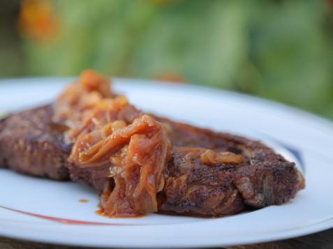 Spice-Rubbed Strip Steaks with Sweet-and-Spicy Onion Sauce