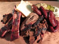 Satiate your craving for barbecue with a stop at Kreuz Market, where you can dig into a heaping plate of succulent meats. They’re seasoned simply with salt and pepper, which lets the oak-wood-smoked flavor shine through. Spareribs, sausage, brisket and turkey are all included in the BBQ Meat Platter.
