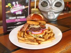 Indulge in tasty eats while letting your imagination soar at this extraterrestrial-themed restaurant. A standout is the Space Cowboy Burger, which stars 10 ounces of meaty goodness topped with Swiss cheese, mushrooms, bacon, onion rings and a special sauce. Old-school arcade games add to the fun.