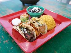 See a turtle race while savoring Caribbean-inspired cuisine at this spot. Take a cue from Curtis Stone and order the chicken tacos. Tender pieces of chicken are marinated in an achiote rub and then steamed inside banana leaves, resulting in a distinctly smoky flavor. Also try the Key West Ceviche.