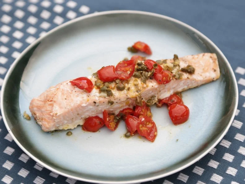 Grilled salmon, tomatoes and capers food beauty, as seen on Food Networkâ  s The Kitchen, Season 6.