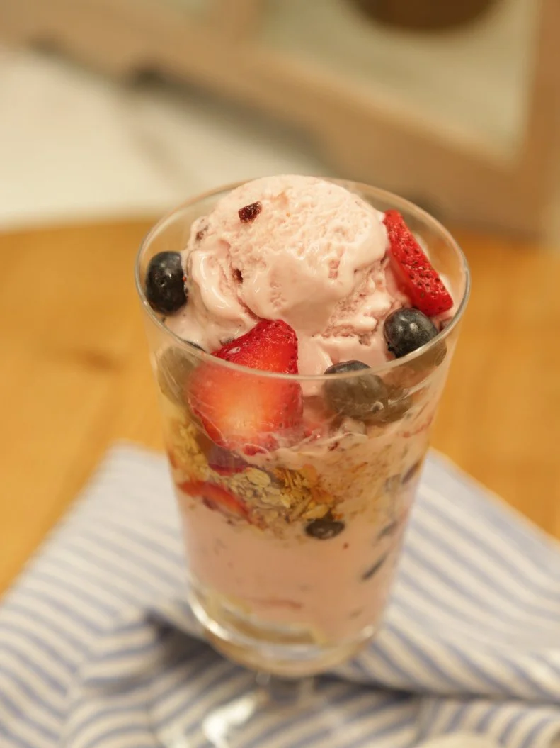 Food beauty of a blueberry cheesecake sundae, as seen on Food Networkâ  s The Kitchen, Season 6.