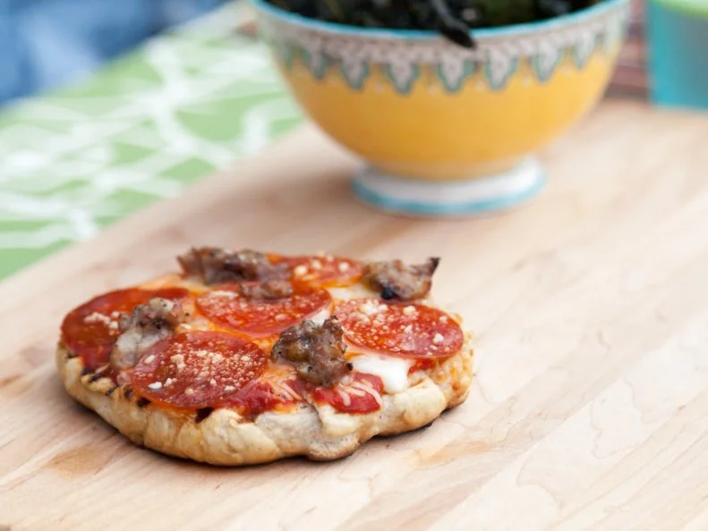 Homemade grilled pizzas and classic kale chips as prepared by host Valerie Bertinelli on the set of Valerieâ  s Home Cooking.