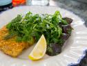 Chicken cutlets topped with spicy arugula and lemon dressing with a side of herb-roasted baby beets, prepared by host Valerie Bertinelli â   a favorite recipe of her husband, Tom.