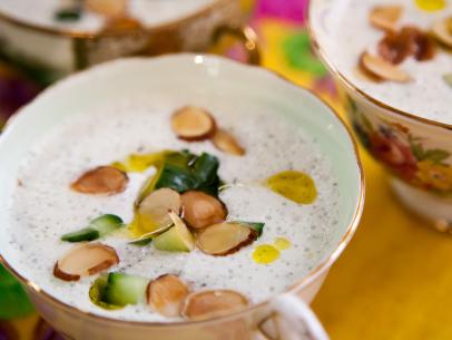 Mint cucumber soup garnished with sliced almonds, mint leaves, and crÃ¨me fresh, as prepared by host Valerie Bertinelli on Valerieâ  s Home Cooking.