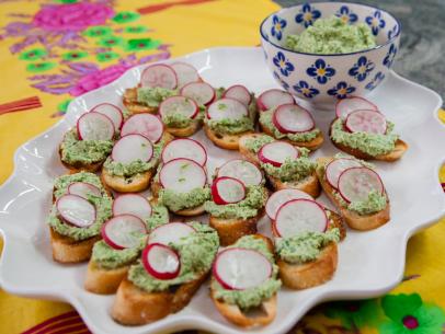 Pureed artichoke crostini with lime salt, garnished with sliced radishes, as prepared by host Valerie Bertinelli on Valerieâ  s Home Cooking.