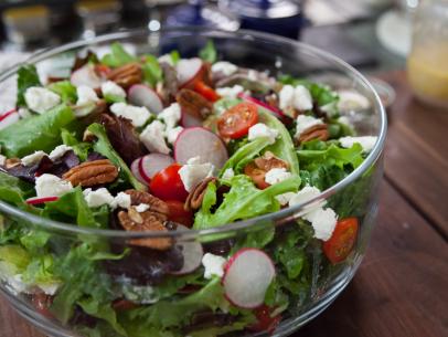 Fresh spring salad, topped with sliced radishes, goat cheese, pecans and homemade dressing, as prepared by host Valerie Bertinelli on Valerieâ  s Home Cooking.