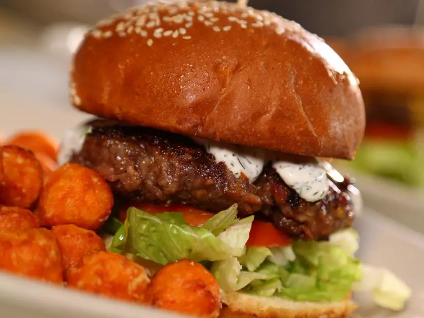 CU shot of the Habanero Parmesen Bacon Burger of The Lodge Sasquatch Kitchen in Ft. Collins, CO as seen on Diners, Drive-Ins and Dives episode 2306.
