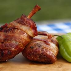 Bacon wrapped pig wings are a delight for those attending the Got to Be NC festival, as seen on Food Network's Carnival Cravings with Anthony Anderson, Season 1.