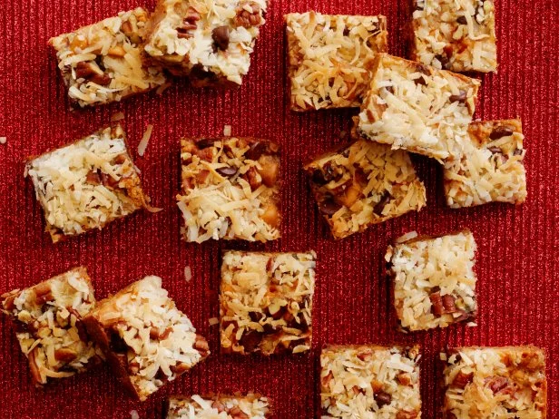 FNK MAGIC BARSFood Network KitchenFood NetworkUnsalted Butter, Graham Crackers, Sweetened Condensed Milk, Semisweet Chocolate Chips,Butterscotch or Peanut Butter Chips, Pecans, Sweetened Coconut