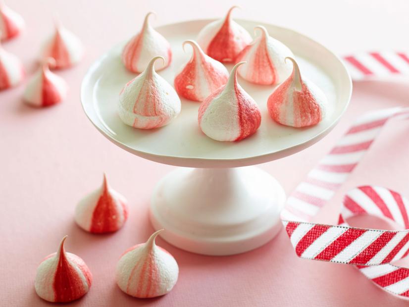 FNK PEPPERMINT MERINGUES
Food Network Kitchen
Food Network
Eggs, Fine Salt, Cream of Tartar, Superfine Sugar, Red Food Coloring, Peppermint Extract,
Pastry Bag