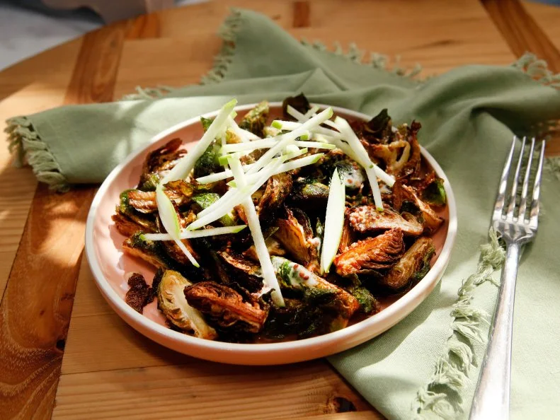 Geoffrey Zakarian's Fried Brussels Sprouts with Creamy Mustard and Cider Dressing dish is seen on the set of Food Network's The Kitchen, Season 7.