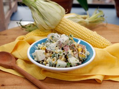 Host Marcela Valladolid's Grilled Corn and Poblano Potato Salad dish is seen on the set of Food Network's The Kitchen, Season 7.