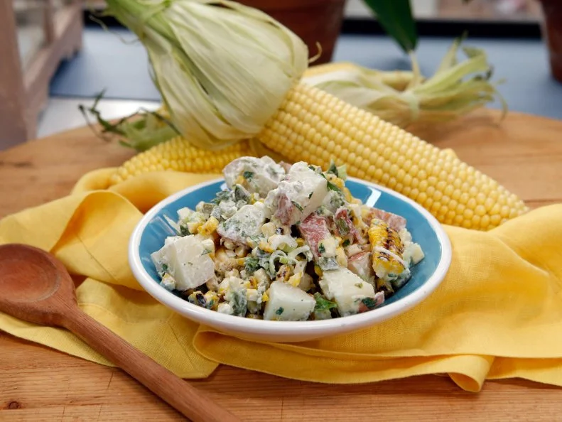 Host Marcela Valladolid's Grilled Corn and Poblano Potato Salad dish is seen on the set of Food Network's The Kitchen, Season 7.