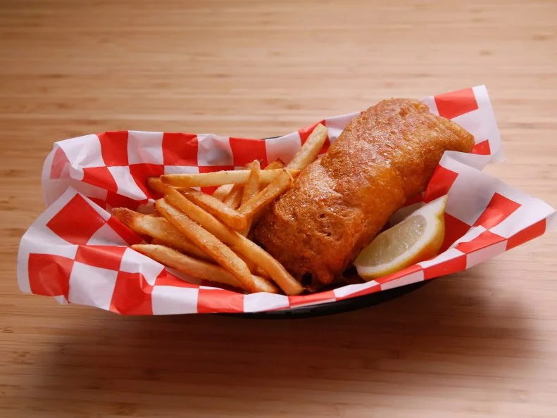 Host Anne Burrell's demonstrates her Fish and Chips is displayed on the set of Food Network's Worst Cooks in America, Season 8.