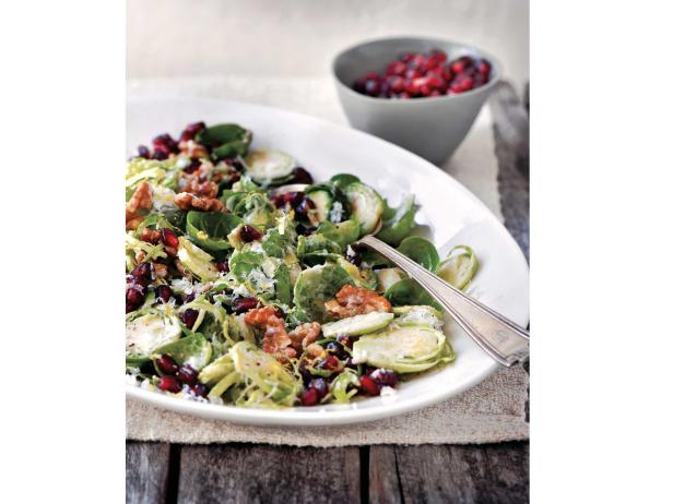 Shredded Brussels Sprouts with Pomegranate Seeds, Walnuts, and Manchego