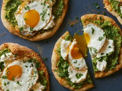 Bobby Flay's Breakfast Pizza with Zucchini Pesto, Provolone, Smoked Ricotta and Olive Oil Fried Egg as seen on Brunch at Bobby's.