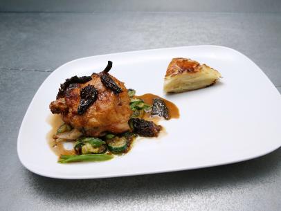 Nicole Sullivan's third course, Half Cornish Game Hen with Morels and Pommes, is displayed, as seen on Food Network's Worst Cooks in America, Season 9.