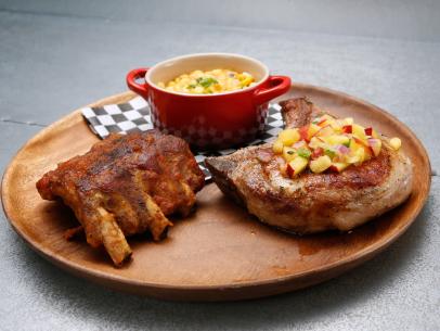 Loni Love's third course, Southern Comfort Glazed Baby Back Ribs and Cast Iron Pork Chops with Nectarine Pico de Gallo Served with Pimiento Cheese Creamed Corn, is displayed, as seen on Food Network's Worst Cooks in America, Season 9.